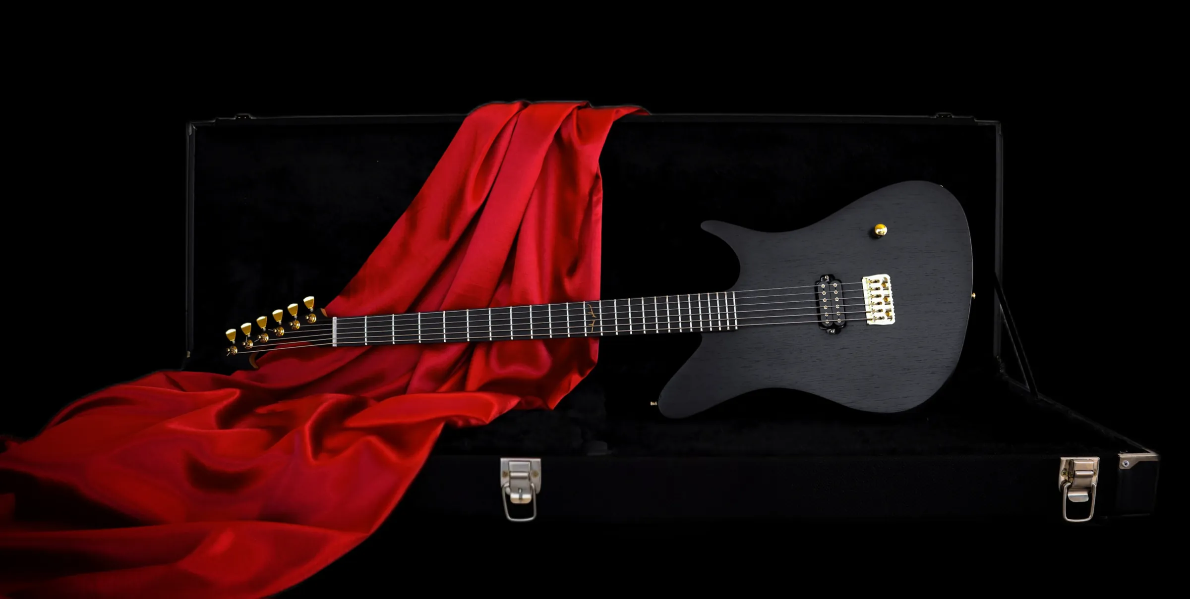 The Pan 630 in its open hardcase, draped in red silk